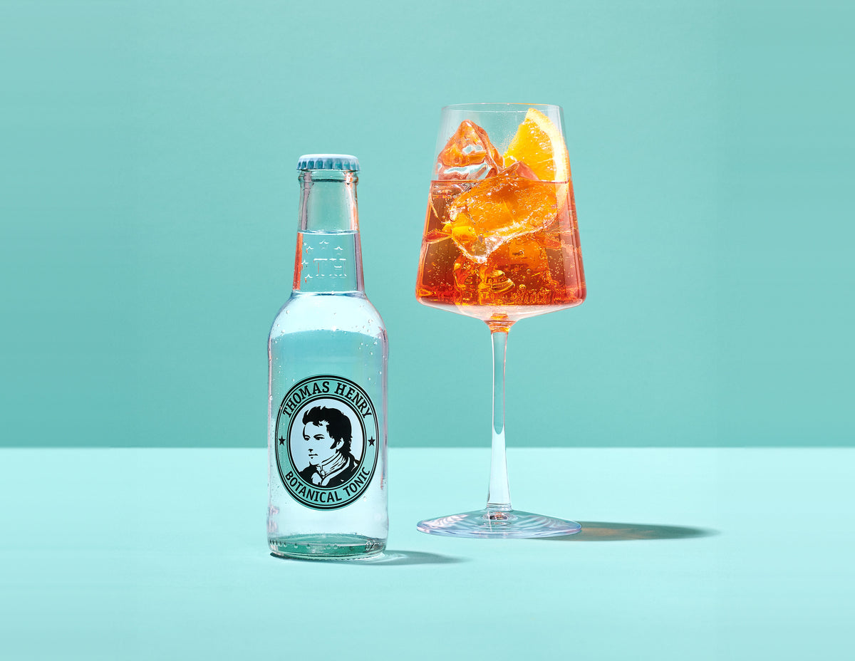 Thomas Henry Botanical Tonic 200ML bottle beside a spritz serve